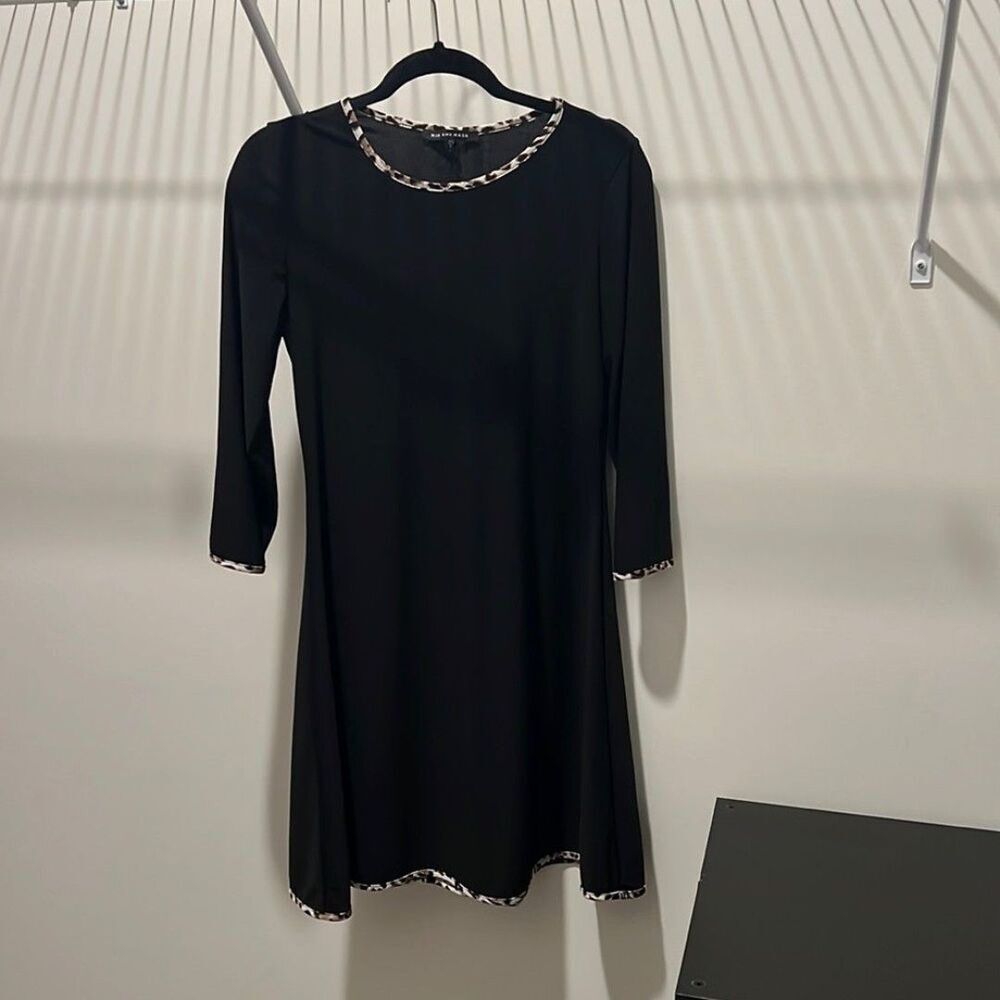 Black dress with leopard trim